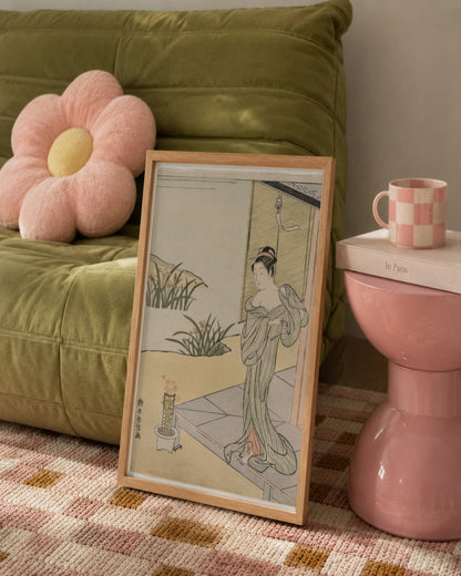 Suzuki Harunobu - Young Woman Looking at a Pot of Pinks - framed print in a styled room