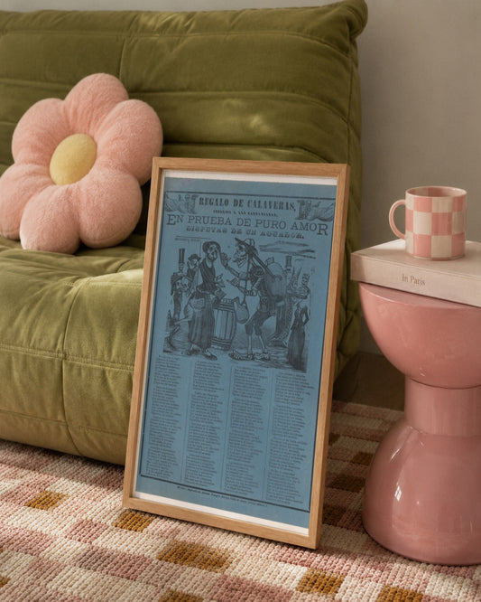 José Guadalupe Posada - In proof of true love, a watercarrier skeleton arguing with a woman (Posada); two skeleton angels in upper corners (Manilla) - framed print in a styled room